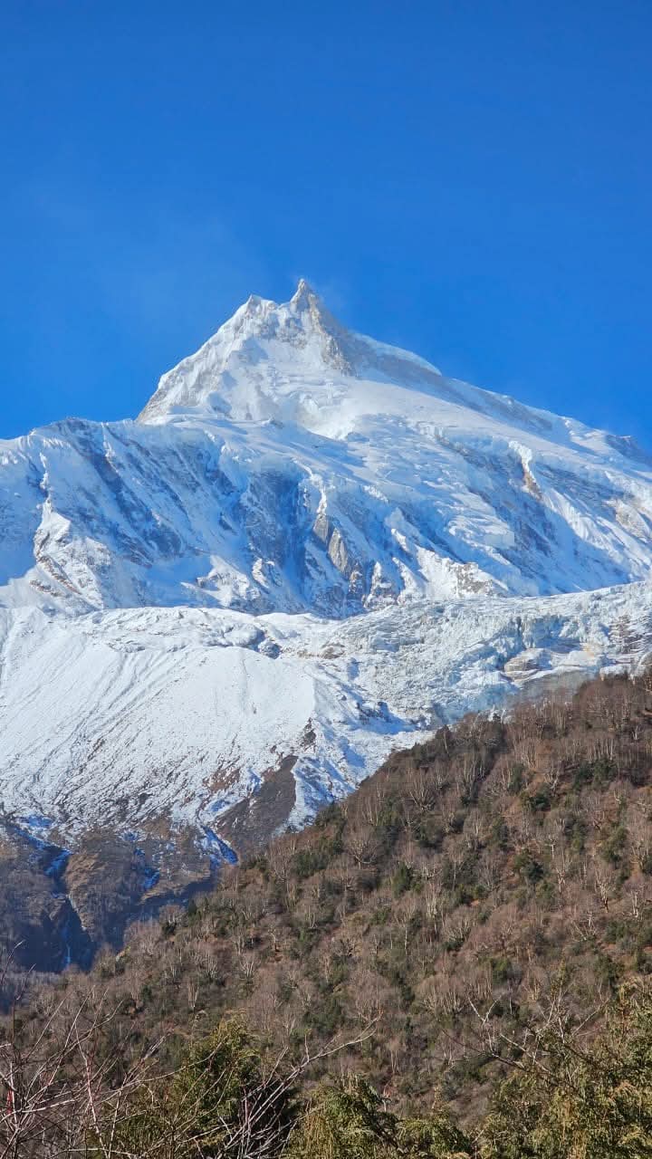 Solo trekker crossing Larkya La Pass Manaslu 2026